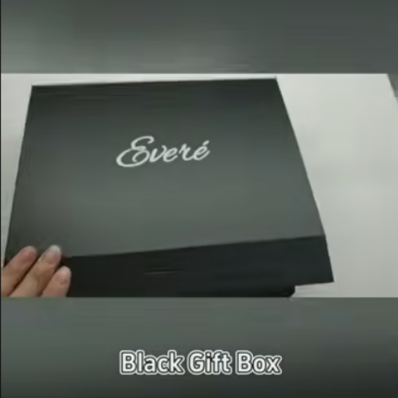 Black magnet box with silver logo and ribbon