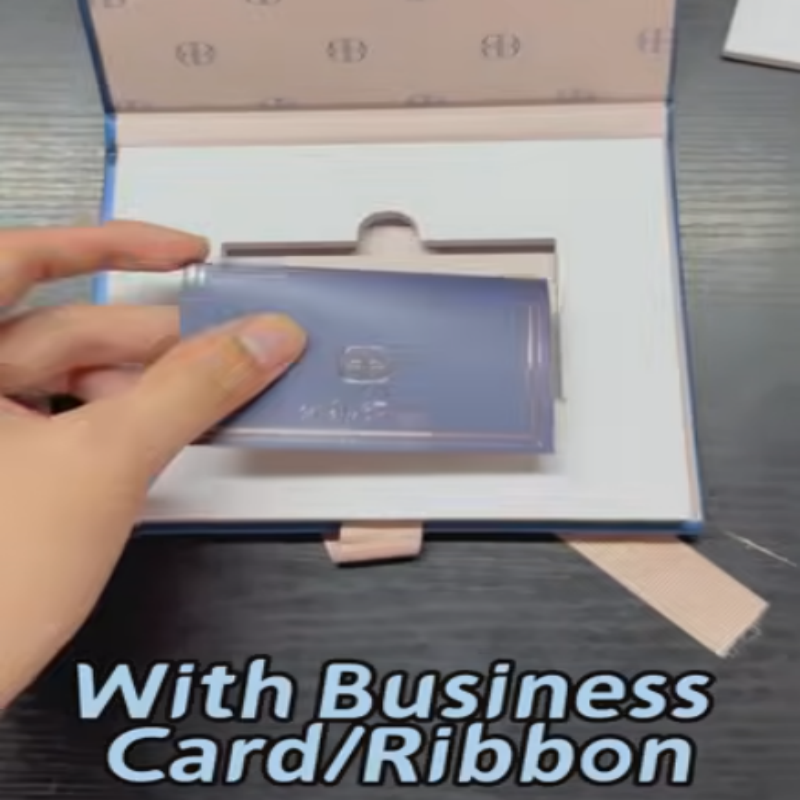 The blue small book-shaped box has a ribbon